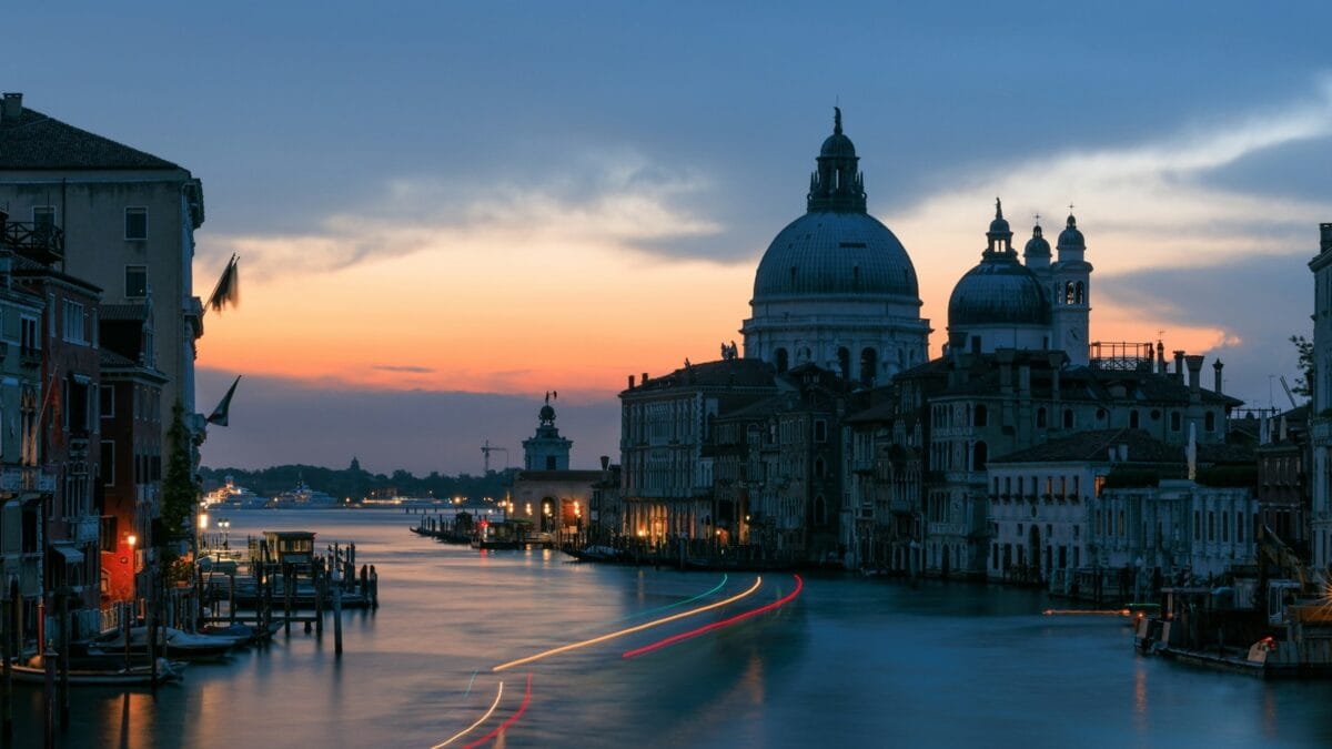 Grand Canal At Twilight With Illuminated Buildings And Boat Light Trails, A Reason To Stay Overnight In Venice